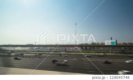 Dubai Metro. A view of the city from the subway car on road, Dubai, UAE. Timelapse 128045746