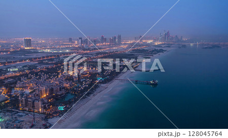 Skyline view of Dubai from night to day transition, UAE. Timelapse 128045764
