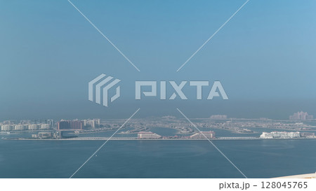 View on artificial island Palm Jumeirah in Dubai, UAE timelapse 128045765