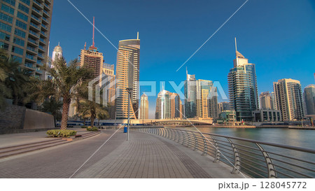 Dubai Marina with tallest skyscrapers and boats timelapse hyperlapse 128045772