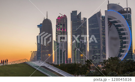The high-rise district of Doha day to night timelapse after sunset 128045816