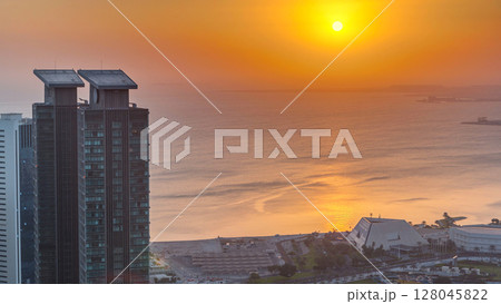The skyline of West Bay and Doha City Center during sunrise timelapse, Qatar 128045822