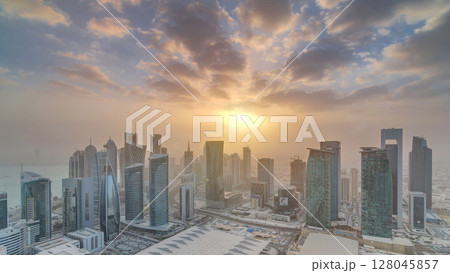 Skyscrapers at sunset timelapse in the skyline of commercial center of Doha, the capital Qatar Skyscrapers at sunset timelapse in the skyline of commercial center of Doha, the capital Qatar 128045857