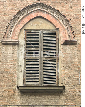 Medieval window of Italian buildigns with closing doors in wood 128050720