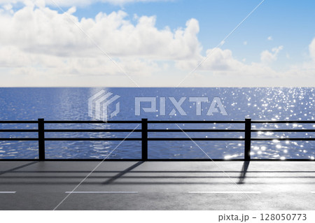 キラキラ光るガードレールのある海沿いの道 キラキラ光るガードレールのある海沿いの道 128050773