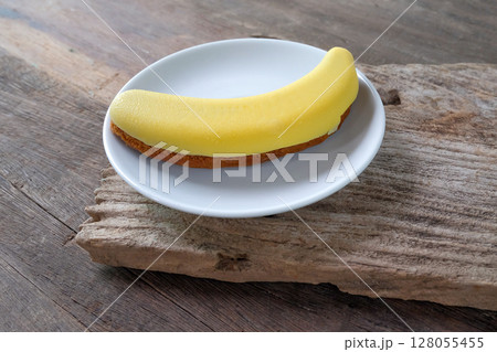 sweet and delicious choco banana cake on white dish. 128055455