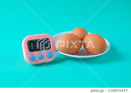 Brown egg boiled with Egg timer,Kitchen tool. Brown egg boiled with Egg timer,Kitchen tool. 128055457