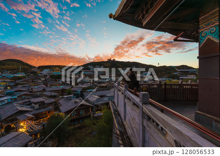 View of Shangri-La's Old Town from a Traditional Balcony at Sunset View of Shangri-La's Old Town from a Traditional Balcony at Sunset 128056533
