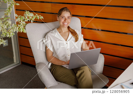 A Professional Woman Engaged in Remote Work Within a Contemporary Office Environment A Professional Woman Engaged in Remote Work Within a Contemporary Office Environment 128056905