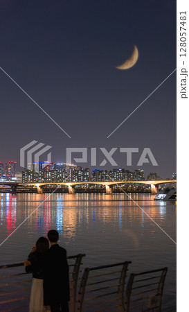 Seoul Romantic Night at Yeouido Park with Crescent Moon and Couple. 128057481