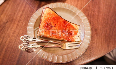 baked basque cheese cake looks like creme brulee custard cake with caramelized top  128057604