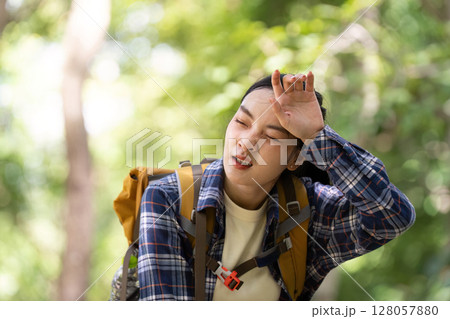 Hiking Challenge: Young Woman Feeling Exhausted in Nature 128057880