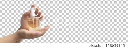 Holding a bottle of hand sanitizer or antiseptic Holding a bottle of hand sanitizer or antiseptic 128059146