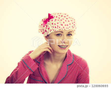 Funny woman wearing pajamas and bathing cap Funny woman wearing pajamas and bathing cap 128060693