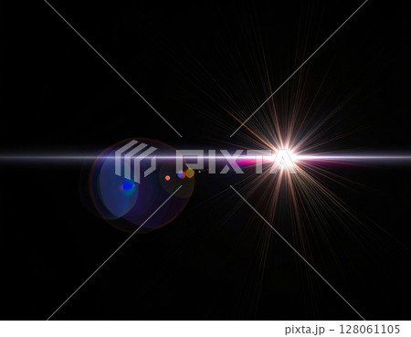 Bright Starburst Lens Flare on Black Background 128061105