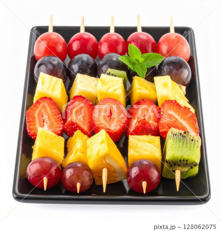 Colorful Fruit Skewers on Black Plate 128062075