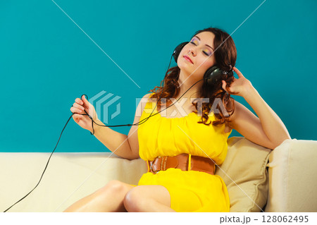 girl with headphones listening music mp3 128062495