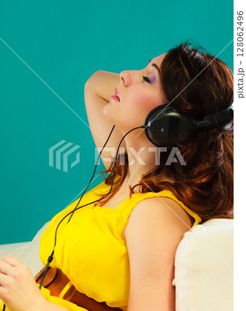 girl in big headphones listening music mp3 relaxing girl in big headphones listening music mp3 relaxing 128062496