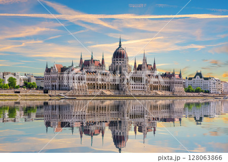 Budapest Parliament side view reflecting in Danube River, famous landmark of Hungary 128063866