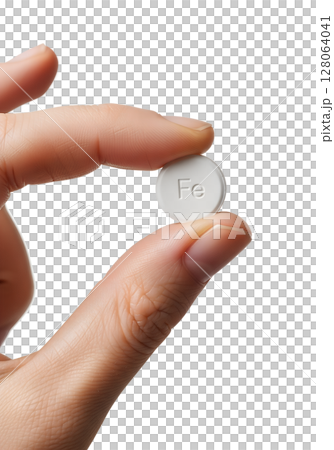Iron supplement tablet held in hand, health and anemia treatment concept mineral pill dietary nutrition Iron supplement tablet held in hand, health and anemia treatment concept mineral pill dietary nutrition 128064041
