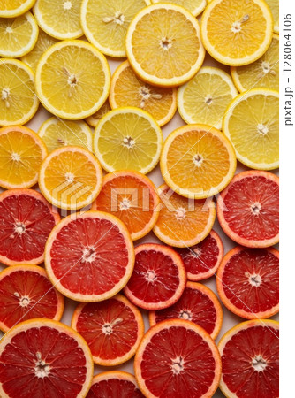 Vibrant Citrus Fruit Slices Background 128064106