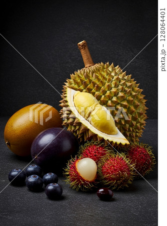 Exotic Fruit Still Life on Dark Background 128064401