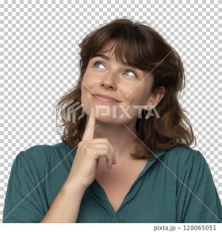 Thoughtful woman with slight smile looks upward, wearing teal blouse. Her expression suggests curiosity or contemplation. background is plain, emphasizing her facial expression 128065051