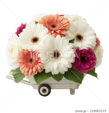 Charming arrangement of white, orange, and pink gerbera daisies and roses is beautifully displayed in small, decorative cart, creating delightful and cheerful floral centerpiece 128065275