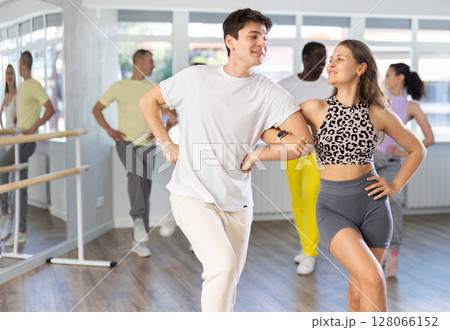 Group of middle aged dancers rehearsing ballroom dances in dance studio 128066152