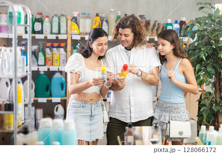 Family choosing repellent in supermarket Family choosing repellent in supermarket 128066172