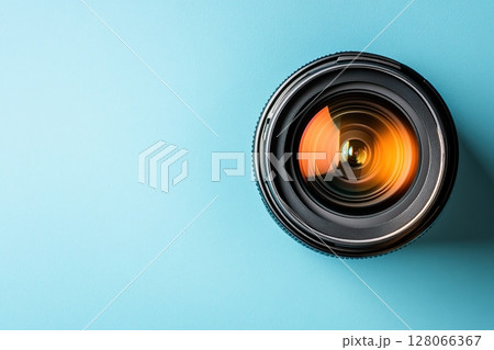 New camera lens on blue background 128066367