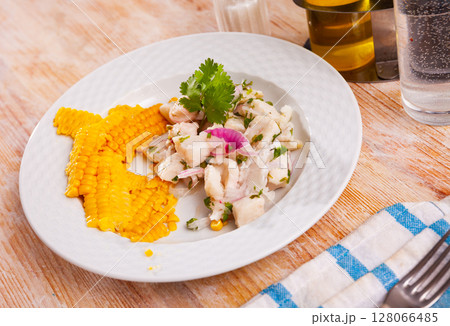 Ceviche of trout served with onion, parsley and corn 128066485