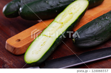 Many ripe cucumbers on wooden surface Many ripe cucumbers on wooden surface 128066557
