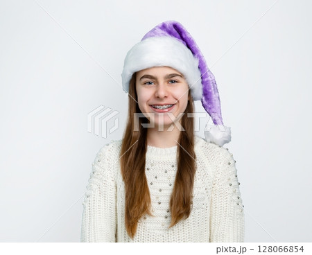 Girl Santa hat showing joy, delight, surprise, approval. Happy emotions, joy Christmas concept. 128066854