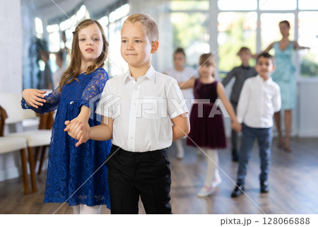 Group of preteen children movements of waltz in dance studio 128066888