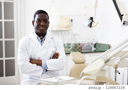 Portrait of positive male dentist Portrait of positive male dentist 128067226