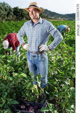 Portrait of satisfied farmer in front of his farm on sunny summer day Portrait of satisfied farmer in front of his farm on sunny summer day 128067470