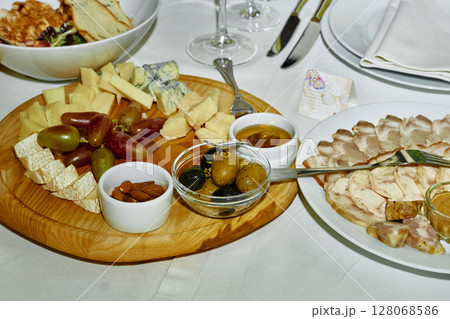 Festive delicious appetizers,snacks and salads on the banquet wedding table 128068586