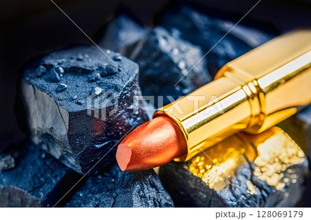 Sensual bright female lipstick among black coal 128069179