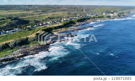 Elevated Vantage Over Cliffside Village and Roaring Surf Elevated Vantage Over Cliffside Village and Roaring Surf 128071083