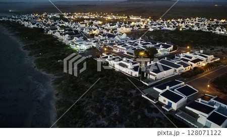 Twilight Illumination Over Coastal Village Twilight Illumination Over Coastal Village 128071122