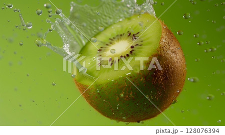 Kiwi fruit flying in water with bubble, organic botanical gardening real food Kiwi fruit flying in water with bubble, organic botanical gardening real food 128076394