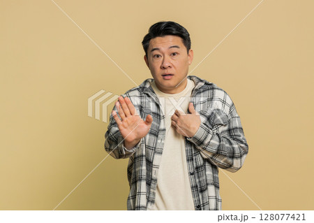 Asian man being uninvolved, clueless face expression, feels innocent, not his fault, fail mistake Asian man being uninvolved, clueless face expression, feels innocent, not his fault, fail mistake 128077421