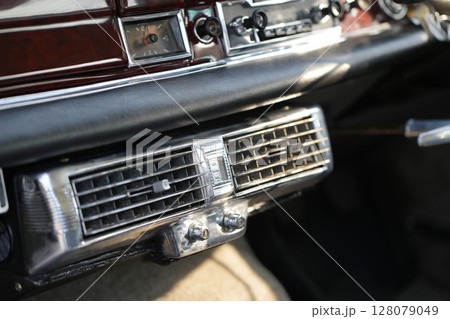 Classic car air vents are captured in close up, focusing on their structure and function, proving the system still works effectively and looks visually clean. Classic car air vents are captured in close up, focusing on their structure and function, proving the system still works effectively and looks visually clean. 128079049