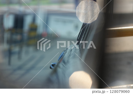 The inner door handles of a vintage car are captured in a clean view, reflecting the classic design and preserved components that represent the simplicity and authenticity of vintage cars. The inner door handles of a vintage car are captured in a clean view, reflecting the classic design and preserved components that represent the simplicity and authenticity of vintage cars. 128079060