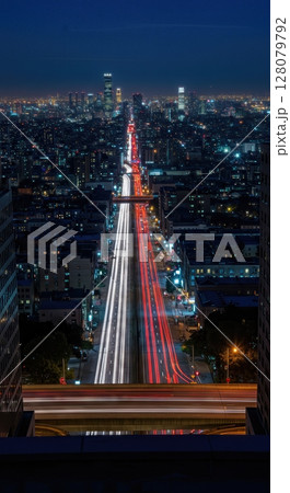 Urban Rooftop Cityscape Night Timelapse with Flowing Traffic and Lights Urban Rooftop Cityscape Night Timelapse with Flowing Traffic and Lights 128079792