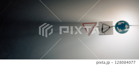 Road Signs in Fog at Night - Minimal Urban Composition 128084077