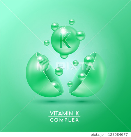 Green vitamin K complex and Minerals float out of the capsule isolated on red background. Dietary supplement for pharmacy advertisement, package design. Vector EPS10. Green vitamin K complex and Minerals float out of the capsule isolated on red background. Dietary supplement for pharmacy advertisement, package design. Vector EPS10. 128084677