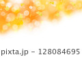 イチョウの葉、背景はオレンジとイエロー、丸ボケ、玉ボケ 128084695
