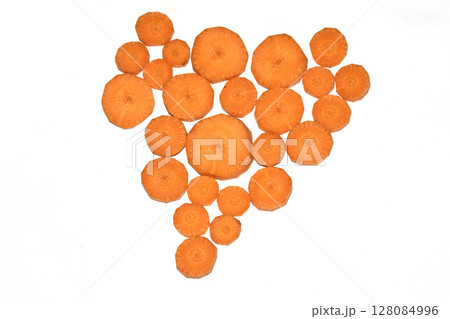 Chopped Sliced Orange Carrot Vegetable Pieces on White Background Chopped Sliced Orange Carrot Vegetable Pieces on White Background 128084996